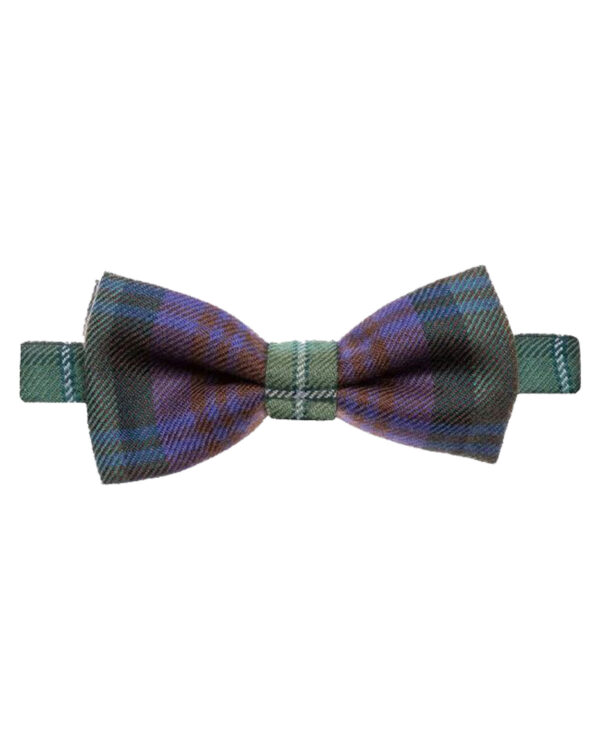 Colorful Scottish tartan bow ties neatly arranged on a table.