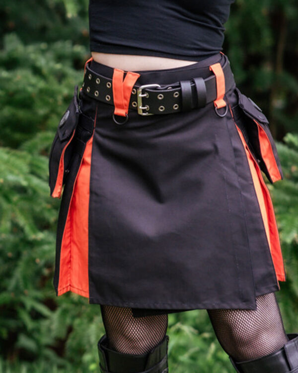 A front view of a Black & Emberglow Hybrid Kilt. The kilt features a sleek black main fabric with bold emberglow orange accents along the pleats and pockets, blending traditional and modern elements with stylish metal buckles on the side.