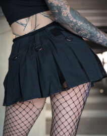 A micro kilt merging gothic mesh and plaid elements, with utilitarian pockets and tactical style for a street-ready look.