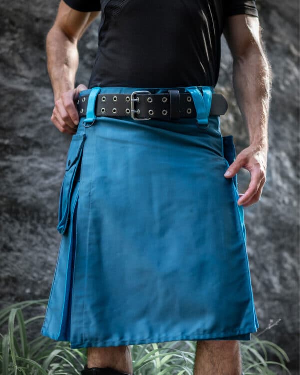 A front view of the Urban Warrior Utility Kilt showcasing its durable, weather-resistant fabric, multiple pockets, and a secure double-prong buckle. The kilt’s modern, rugged design is highlighted with a wide belt for added utility and style.